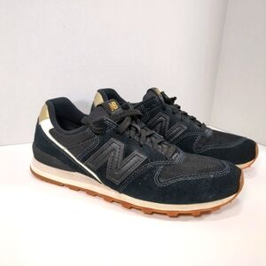 New Balance Black and Gold Sneakers